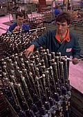 Employees inspect rack and pinion steering gears produced in Eastern Europe for Skoda and Western European automakers.